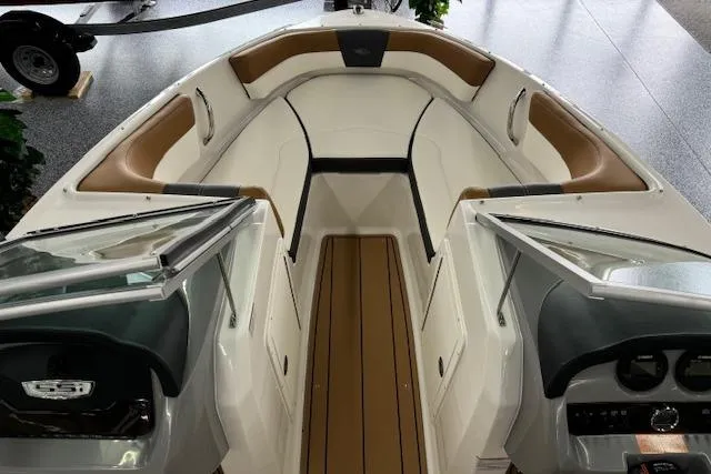 Slide: The Image of 2024 Chaparral 19 SSi OB boat interior with tan and white seating. - 3