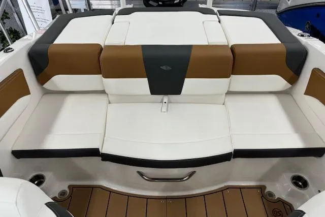 Slide: The Image of 2024 Chaparral 19 SSi OB boat interior with brown and white seating. - 9