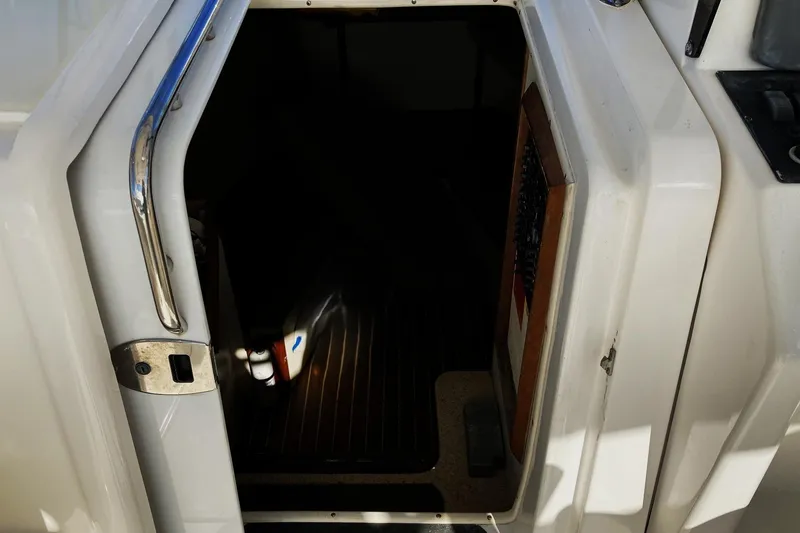 Slide: The Image of Open cabin door of 2006 Luhrs 28 boat, showing interior entryway. - 13