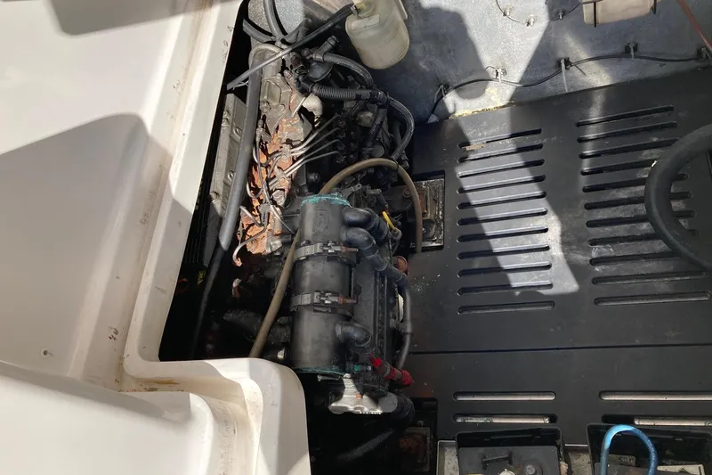 Slide: The Image of Engine compartment of a 2006 Luhrs 28 boat, showing mechanical components and wiring. - 23