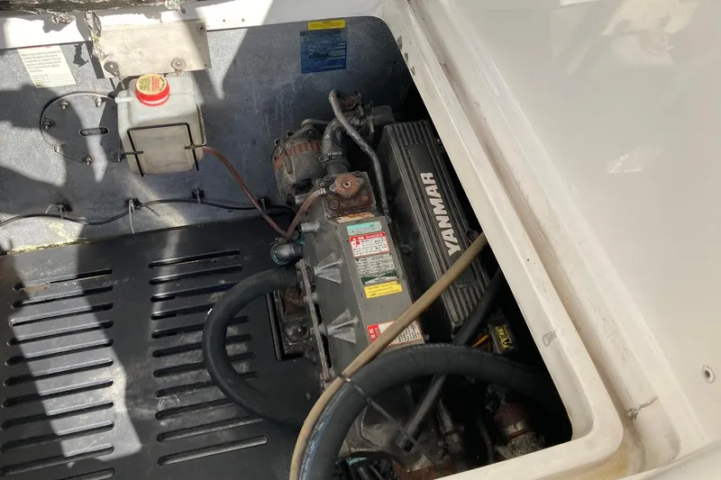 Slide: The Image of Engine compartment of a 2006 Luhrs 28 boat featuring a Yanmar engine. - 24