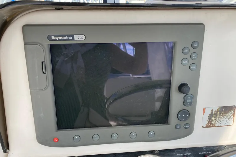 Slide: The Image of Raymarine C120 navigation display on 2006 Luhrs 28 boat dashboard. - 29