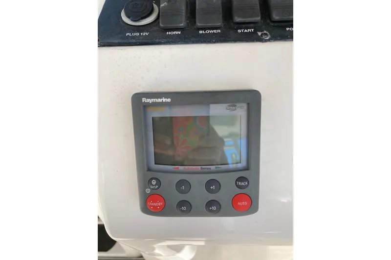 Slide: The Image of Raymarine autopilot control on 2006 Luhrs 28 boat dashboard. - 34