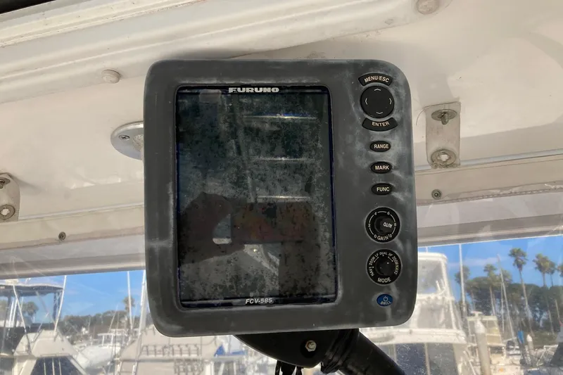 Slide: The Image of Furuno FCV-585 marine display on 2006 Luhrs 28 boat, docked with palm trees in background. - 35