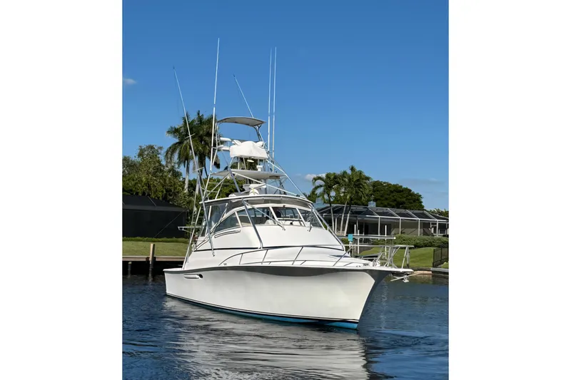 Slide: The Image of 1999 Ocean Yachts 40 Open boat on calm water, clear sky background. - 5