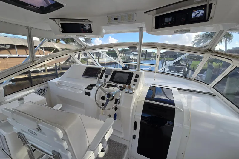 Slide: The Image of 1999 Ocean Yachts 40 Open helm with modern controls and panoramic view. - 17