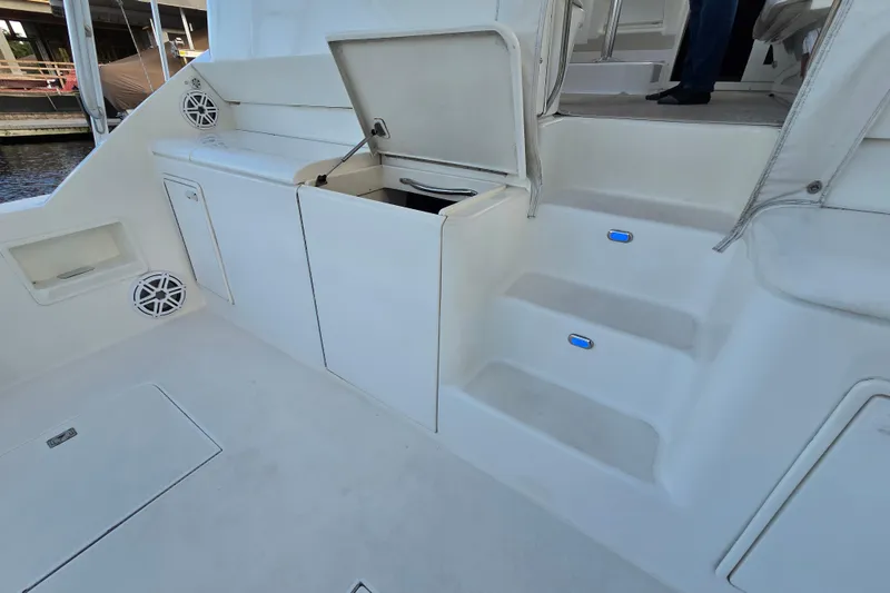 Slide: The Image of 1999 Ocean Yachts 40 Open boat interior with storage compartments and steps. - 23