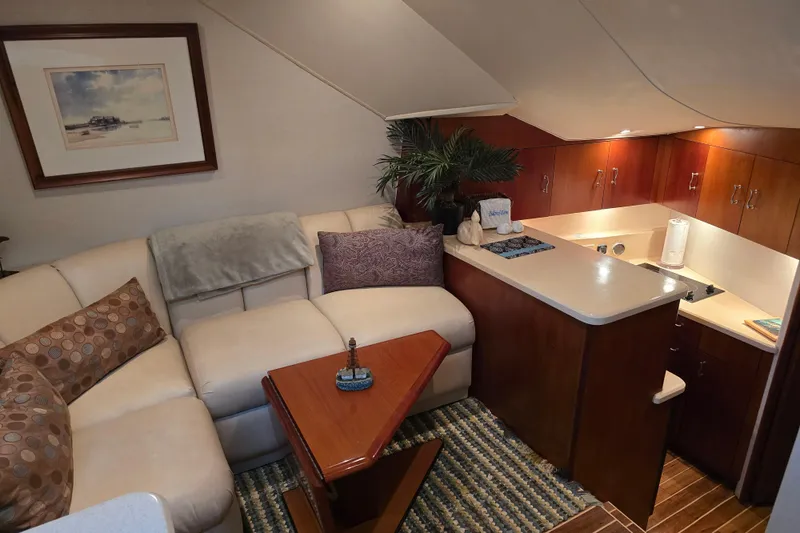 Slide: The Image of Luxurious interior of 1999 Ocean Yachts 40 Open, featuring cozy seating and elegant wood finishes. - 24