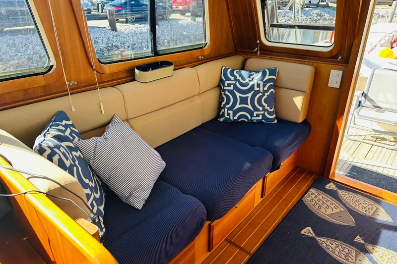 Slide: The Image of Cozy interior of 2006 Sabre 42 Fly Bridge with stylish cushions and wooden accents. - 17