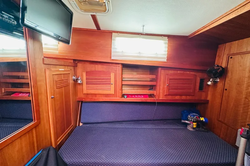 Slide: The Image of Interior cabin of 2006 Sabre 42 Fly Bridge with wood paneling and seating. - 22