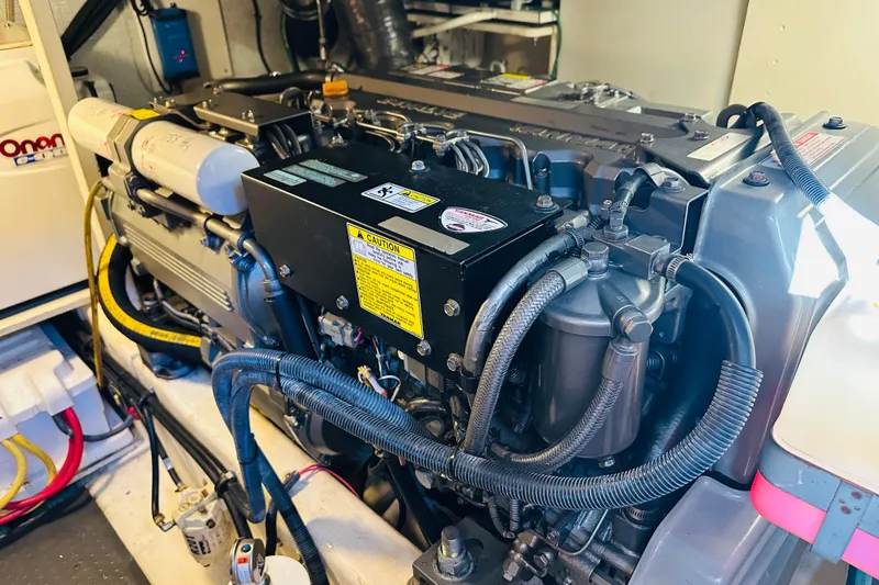 Slide: The Image of Engine room of 2006 Sabre 42 Fly Bridge with detailed mechanical components. - 34