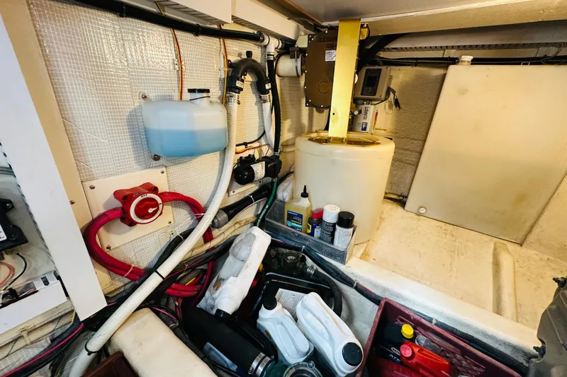 Slide: The Image of Engine room of 2006 Sabre 42 Fly Bridge with maintenance supplies and equipment. - 39