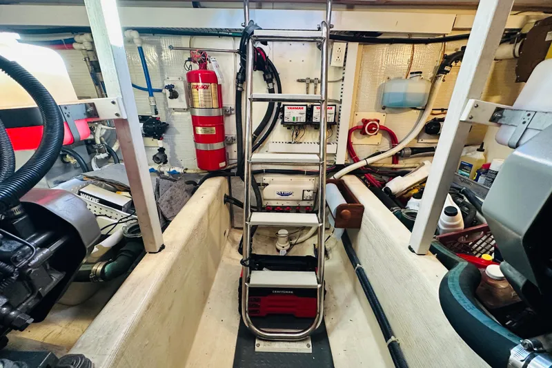 Slide: The Image of Engine room of 2006 Sabre 42 Fly Bridge with equipment and fire extinguisher. - 41