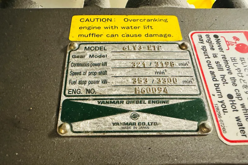 Slide: The Image of Yanmar diesel engine plate with caution labels on Sabre 42 Fly Bridge, 2006 model. - 43