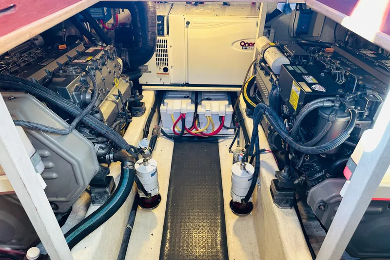 Slide: The Image of Engine room of 2006 Sabre 42 Fly Bridge with dual engines and generator. - 44
