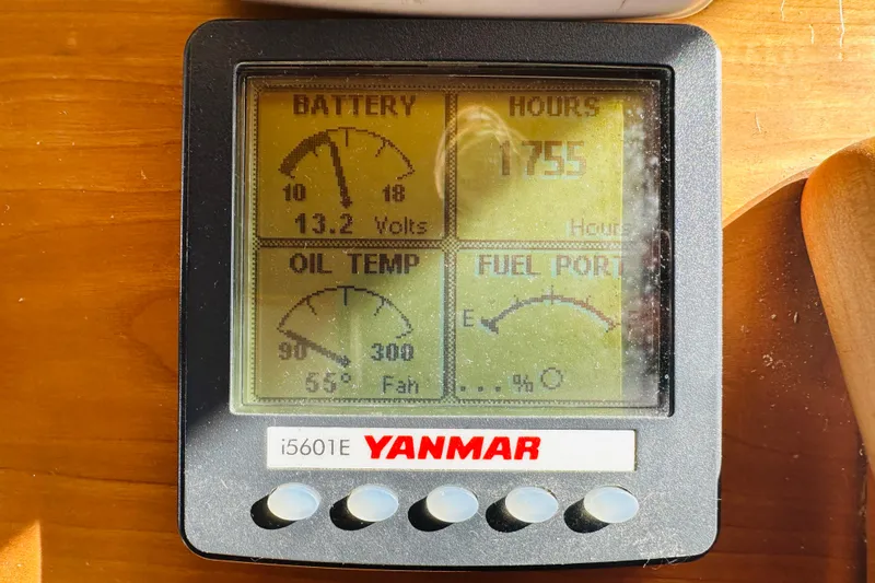 Slide: The Image of Yanmar i5601E display showing battery voltage, engine hours, oil temperature, and fuel level. - 48