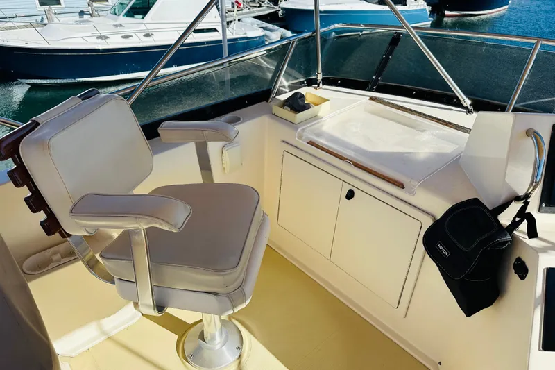Slide: The Image of Flybridge of 2006 Sabre 42 Fly Bridge yacht with captain's chair and console. - 53