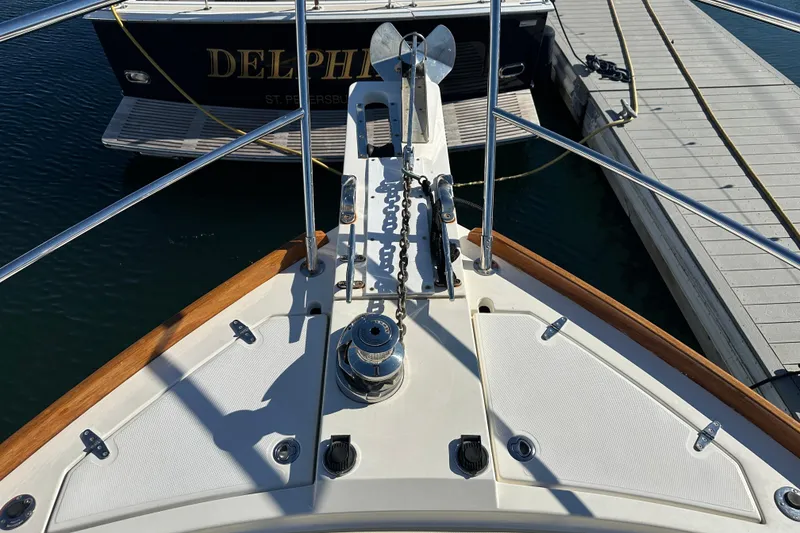 Slide: The Image of Bow view of 2006 Sabre 42 Fly Bridge yacht docked at marina. - 62