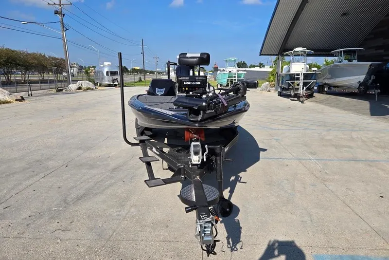Slide: The Image of 2024 Blazer 650 Pro Tour boat on trailer in outdoor lot. - 8