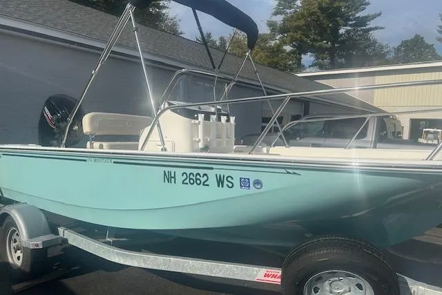 The Image of 2024 Boston Whaler 170 Montauk boat on trailer, light blue hull, parked outdoors. - 0