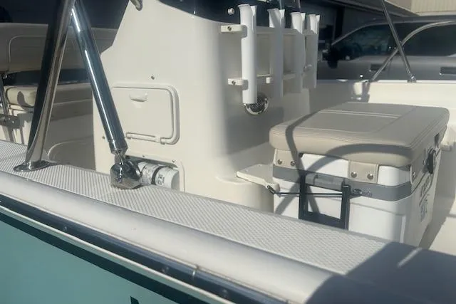 Slide: The Image of 2024 Boston Whaler 170 Montauk interior with seating and storage features. - 3