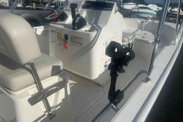 Slide: The Image of 2024 Boston Whaler 170 Montauk boat interior with steering console and seating. - 34