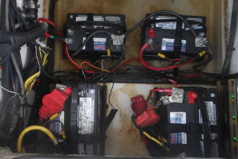 Slide: The Image of Battery compartment of 2022 Stingray 269 DC boat with wiring connections. - 14