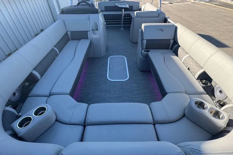 Slide: The Image of 2021 Bennington L 25 Swingback pontoon boat interior with spacious seating and cup holders. - 12