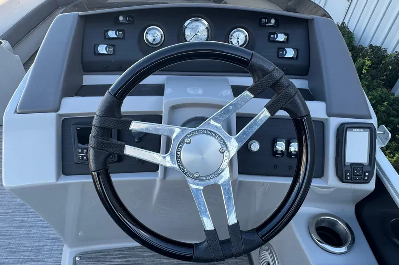 Slide: The Image of Steering console of 2021 Bennington L 25 Swingback boat with gauges and controls. - 15