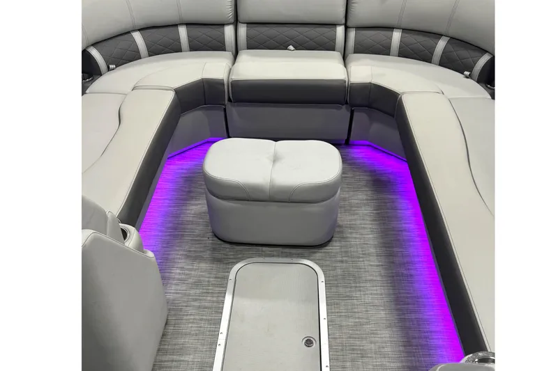 Slide: The Image of Luxurious 2021 Bennington L 25 Swingback boat interior with ambient purple lighting. - 7
