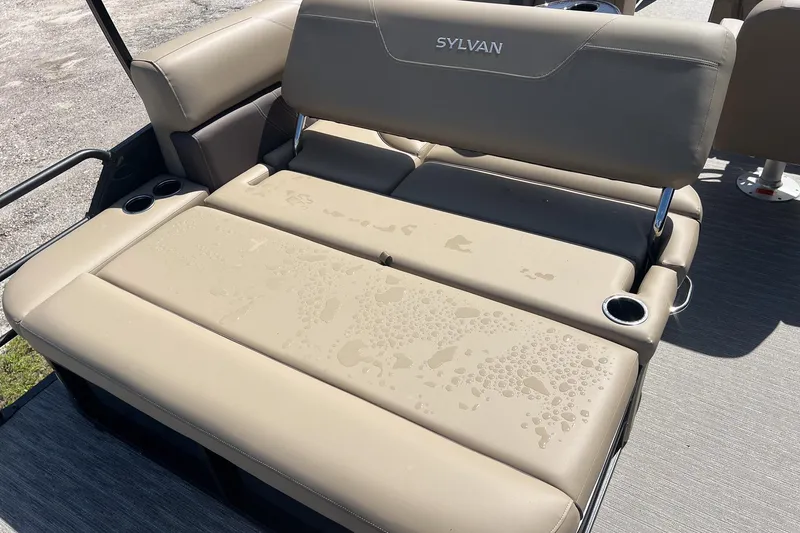Slide: The Image of 2026 Sylvan Mirage 822 CLZ boat seat with water droplets and cup holders. - 21