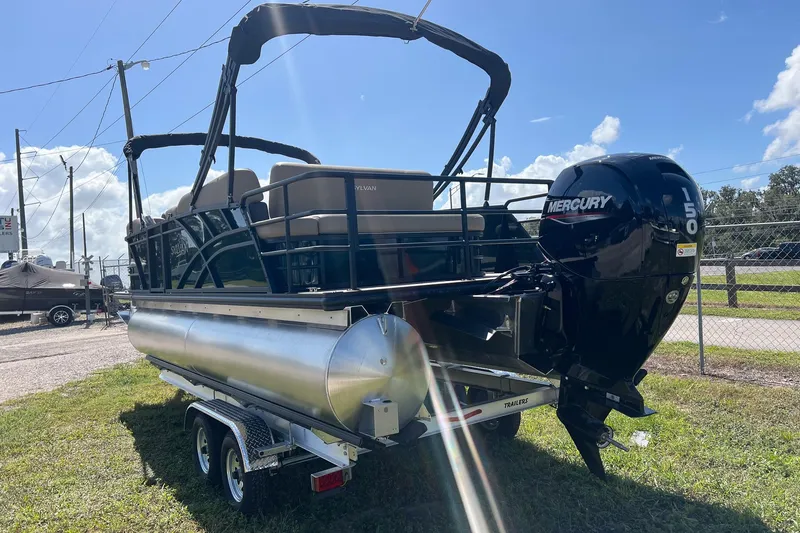 Slide: The Image of 2026 Sylvan Mirage 822 CLZ pontoon boat with Mercury 150 engine on trailer. - 3