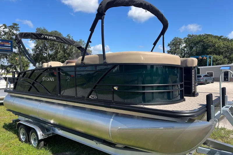 Slide: The Image of 2026 Sylvan Mirage 822 CLZ pontoon boat on trailer, outdoor display. - 7
