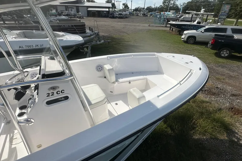 Slide: The Image of 2023 Aquasport 2200 Center Console boat with spacious seating and sleek design. - 9