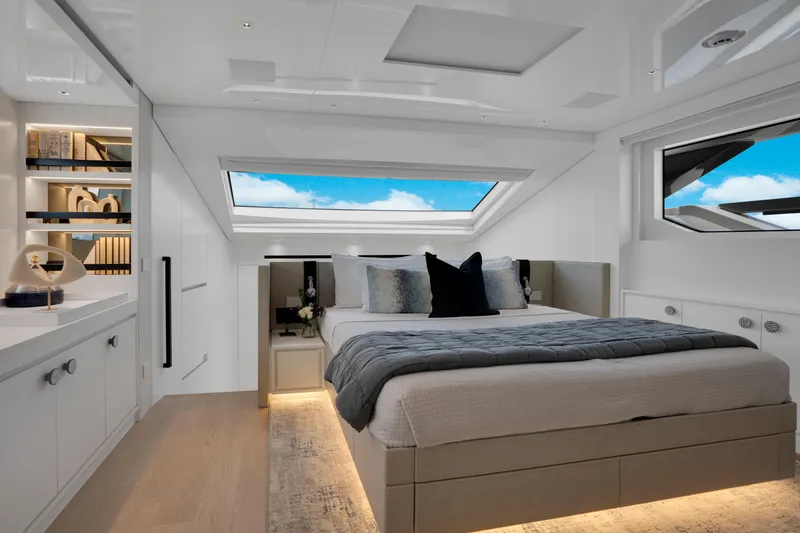 Slide: The Image of Luxurious 2023 Sanlorenzo SL96A yacht bedroom with skylight and modern decor. - 12