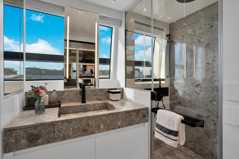 Slide: The Image of Luxurious bathroom on 2023 Sanlorenzo SL96A yacht with marble sink and ocean view. - 15