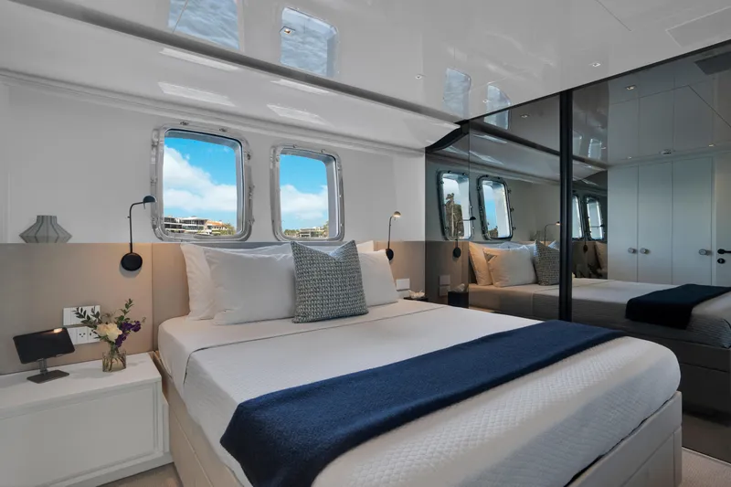 Slide: The Image of Luxurious bedroom interior of 2023 Sanlorenzo SL96A yacht with elegant decor and ocean view. - 21