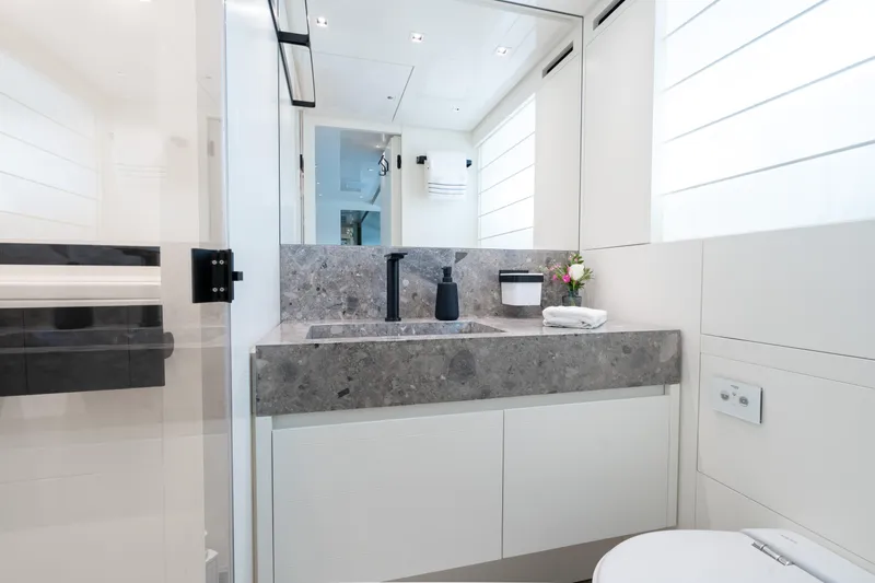 Slide: The Image of Luxurious bathroom in 2023 Sanlorenzo SL96A yacht with modern fixtures and elegant design. - 22