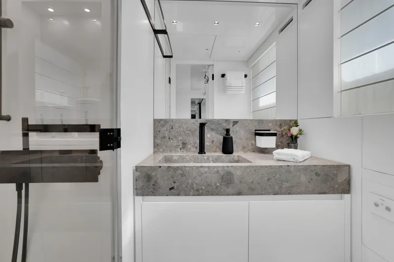 Slide: The Image of Luxurious bathroom interior of 2023 Sanlorenzo SL96A yacht with modern fixtures and elegant design. - 28