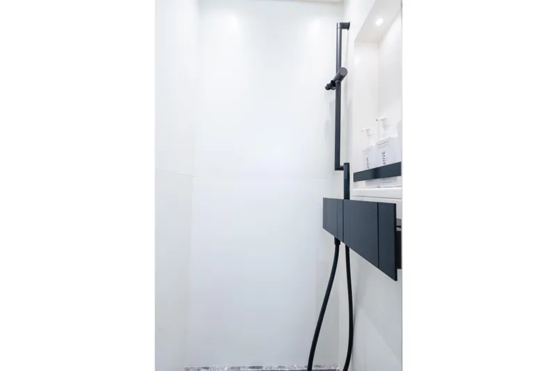 Slide: The Image of Modern shower area in 2023 Sanlorenzo SL96A yacht, featuring sleek black fixtures. - 29