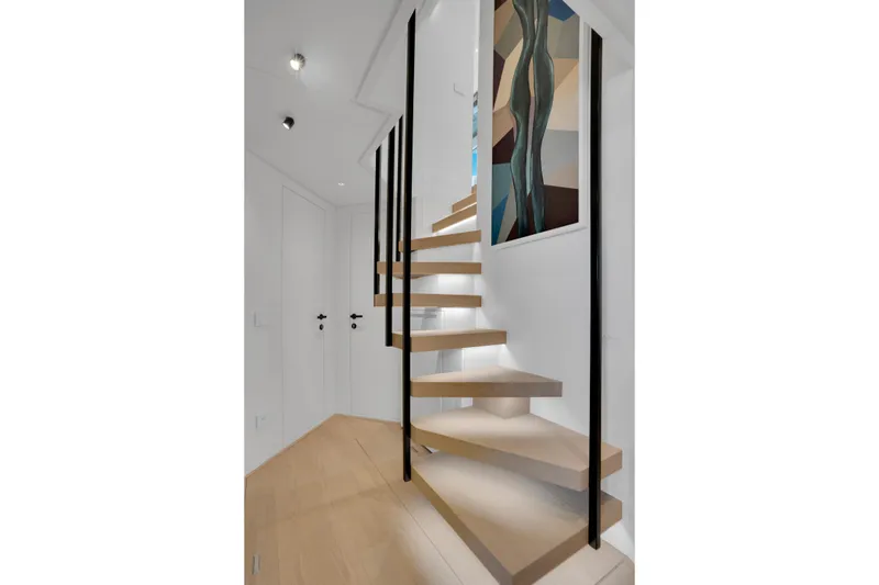 Slide: The Image of Modern spiral staircase on Sanlorenzo SL96A yacht, 2023 model, with sleek design and artwork. - 30