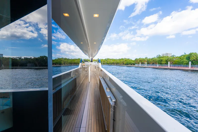 Slide: The Image of 2023 Sanlorenzo SL96A yacht deck with scenic waterway view. - 39