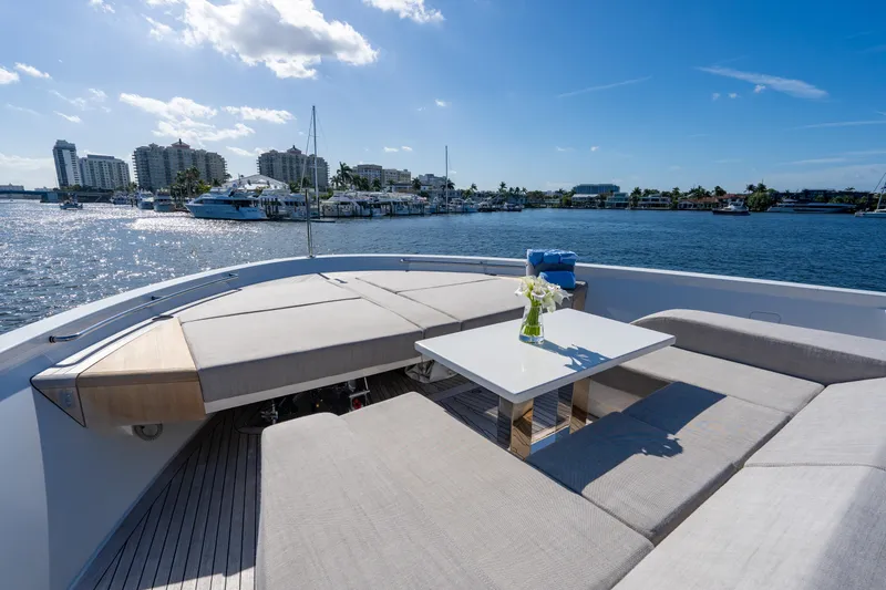 Slide: The Image of Luxurious 2023 Sanlorenzo SL96A yacht with elegant deck seating and scenic waterfront view. - 46