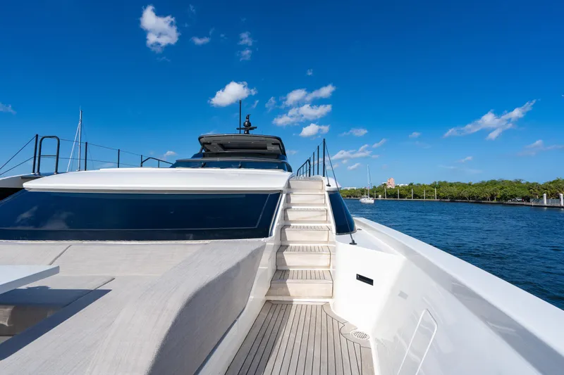 Slide: The Image of 2023 Sanlorenzo SL96A yacht deck with stairs, under clear blue sky. - 47