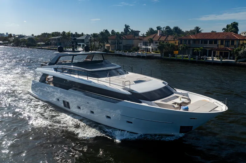 Slide: The Image of Luxurious 2023 Sanlorenzo SL96A yacht cruising on a sunny day near waterfront homes. - 52