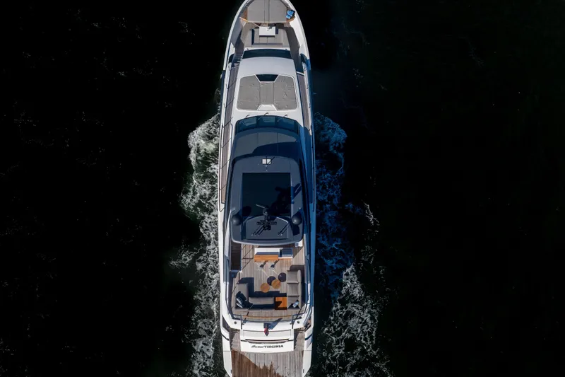 Slide: The Image of Aerial view of 2023 Sanlorenzo SL96A yacht cruising on dark water. - 53