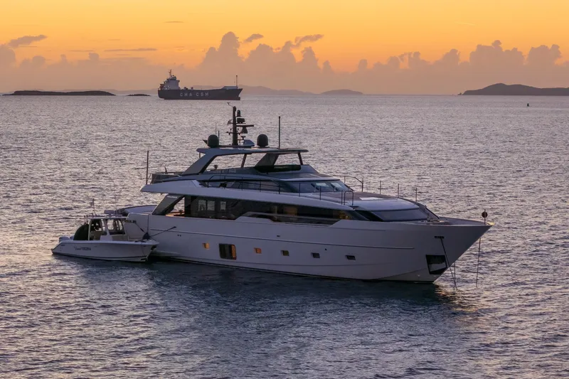 Slide: The Image of 2023 Sanlorenzo SL96A yacht at sunset on calm sea. - 54