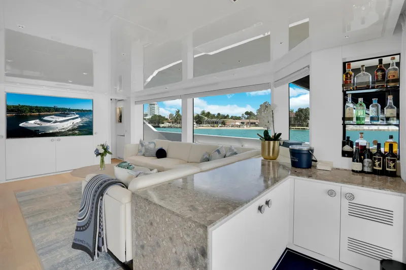 Slide: The Image of Luxurious interior of 2023 Sanlorenzo SL96A yacht with elegant seating and bar area. - 6
