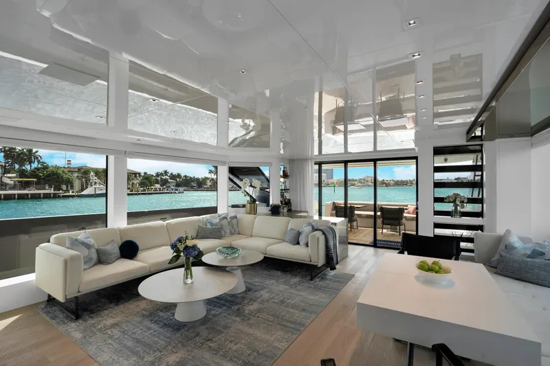 Slide: The Image of Luxurious interior of 2023 Sanlorenzo SL96A yacht with elegant furnishings and waterfront view. - 7
