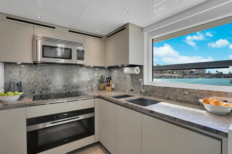 Slide: The Image of Modern kitchen on 2023 Sanlorenzo SL96A yacht with ocean view. - 9
